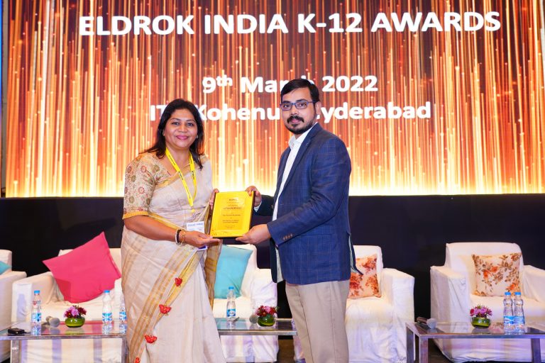 Principal Ms. Trupti Rao receiving an award at the ELDROK INDIA K-12 AWARDS ceremony in Hyderabad