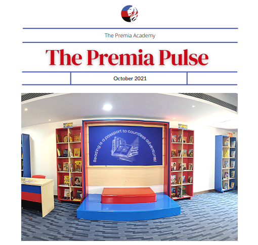 The Premia Academy, Hyderabad, school library reading nook with red and blue bookshelves